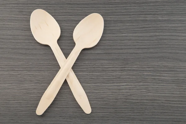 Two wooden spoons on wooden background — Stock Photo, Image