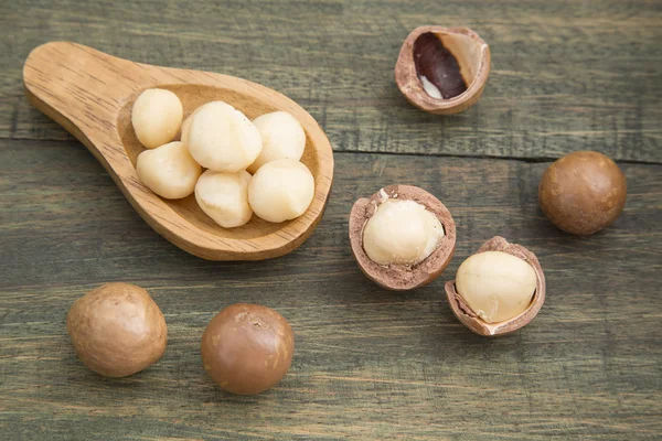 Macadamia nuts on a wooden table — Stock Photo, Image