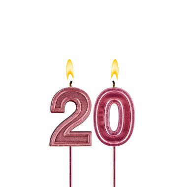Candle number 20 - Lit birthday candle on white background
