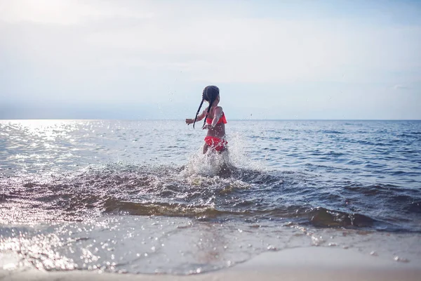 Cute Little Girl Running Sea Sunset Light Lots Splashes Happiness — Stock Photo, Image