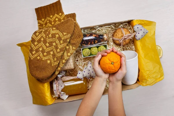 Cute Girl Packing Festive Care Box Tea Honey Cookies Knitted — Stock Photo, Image