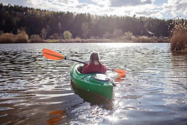 Happy preteen girl kayaking on river, paddle in the hand, summer camp activity, extreme sport — Stock Photo, Image