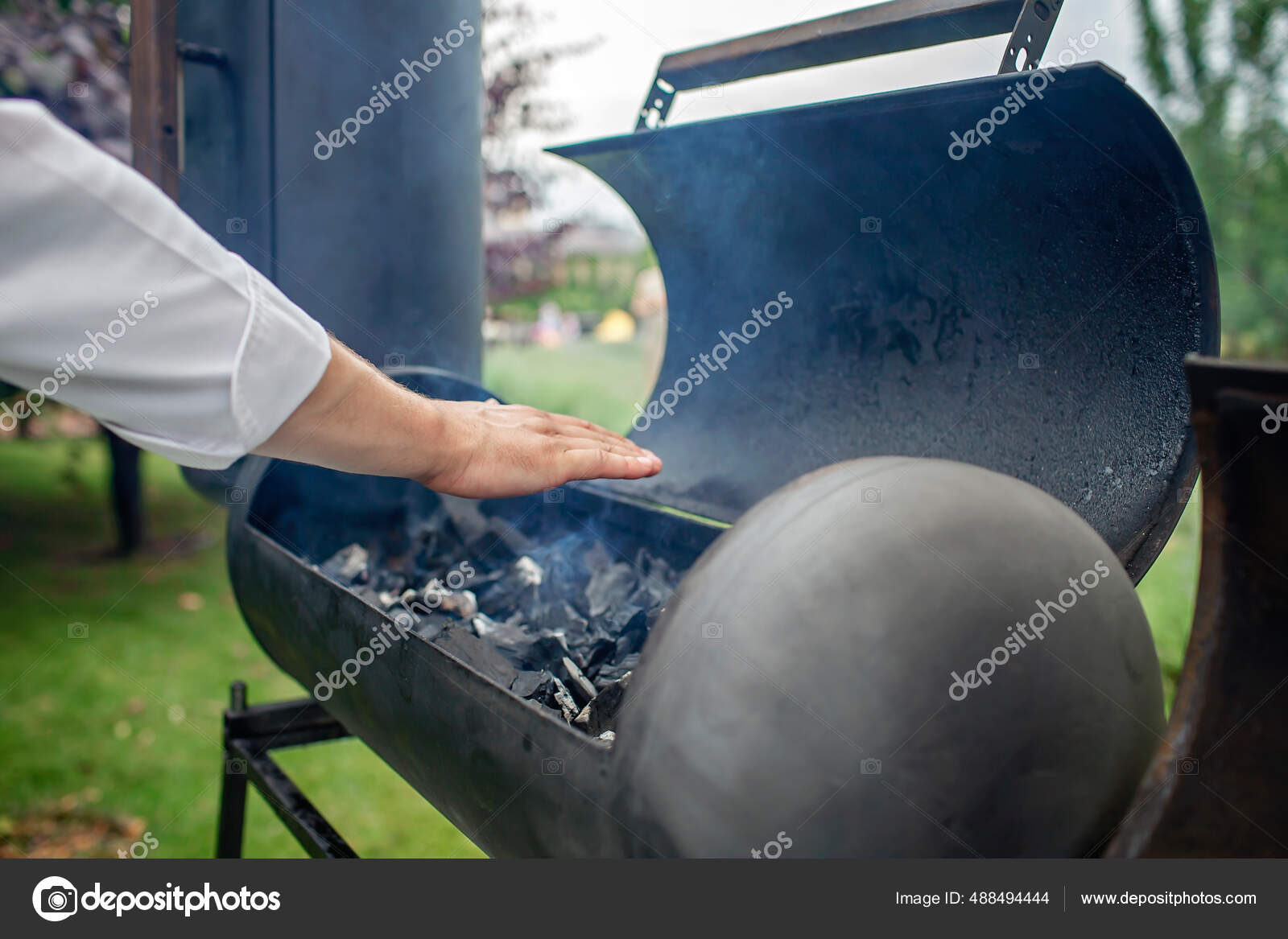 Smoker grill in home backyard, family patio, outdoor bbq party on open