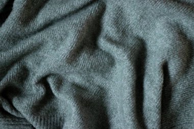 Abstract textured blue green knitted fabric background