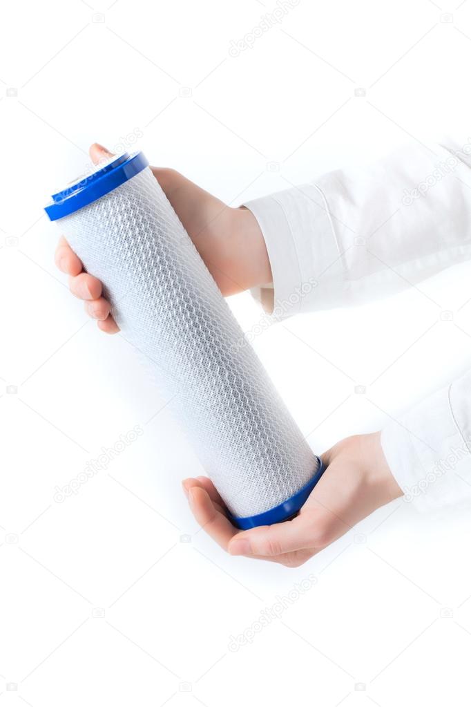 water filter cartridge in human hand