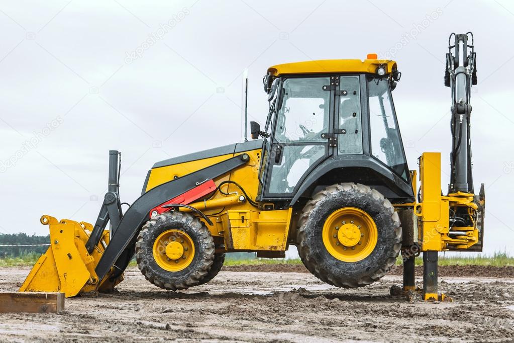 Yellow bulldozer overcome barrier