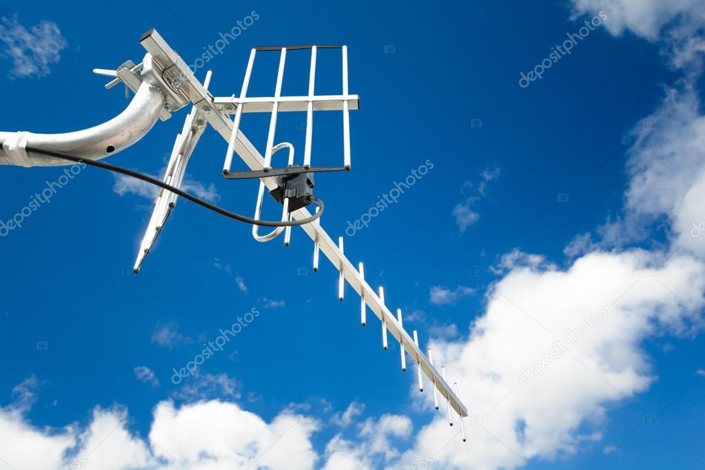 directional antenna for reception of digital television broadcasting DVB-T and DVB-T2 against a blue sky (vertical polarization, UHF, UV resistant coaxial cable)