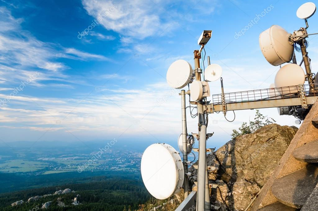 The system of telecommunication aerials high above the landscape