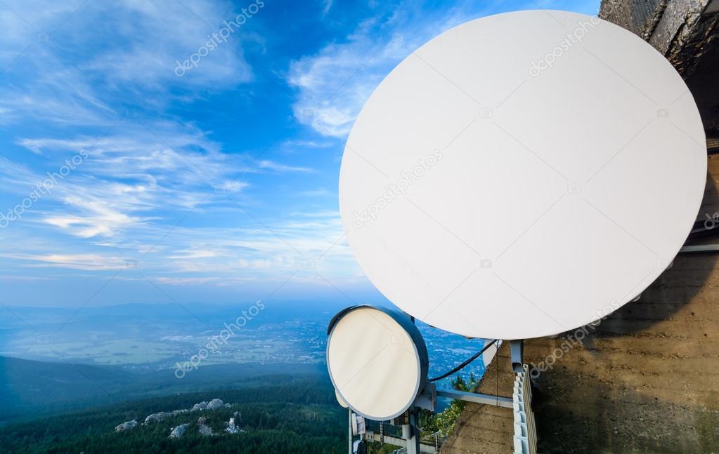 The system of telecommunication aerials high above the landscape