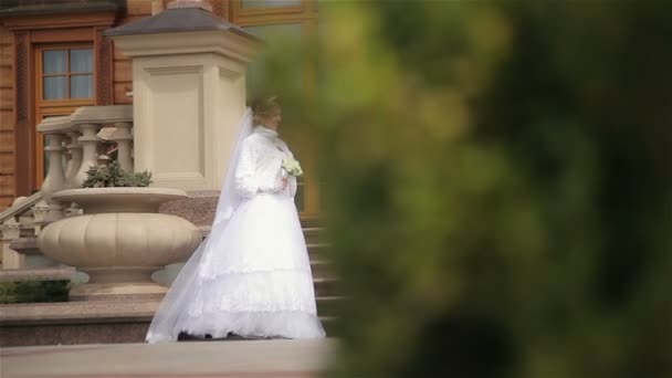 Beautiful bride and groom near house — Stock Video