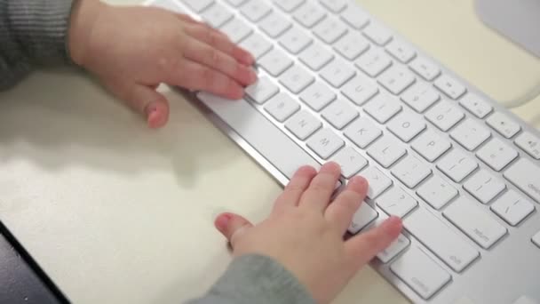 Little girl using a keyboard — Stock Video