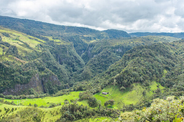 A breathtaking view of Purace National Park in Cauca, Colombia, showcasing lush green mountains and serene natural beauty.