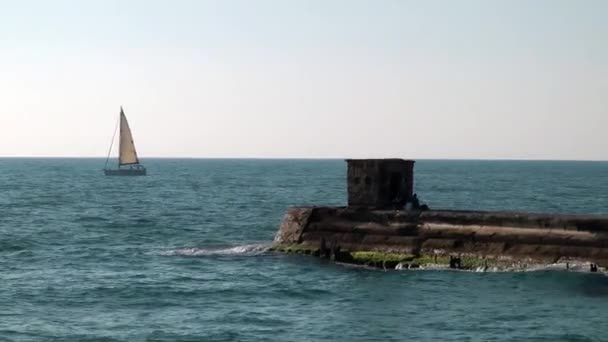 A sailboat on the horizon in the beautiful Mediterrian sea in Tel Aviv — Stock Video
