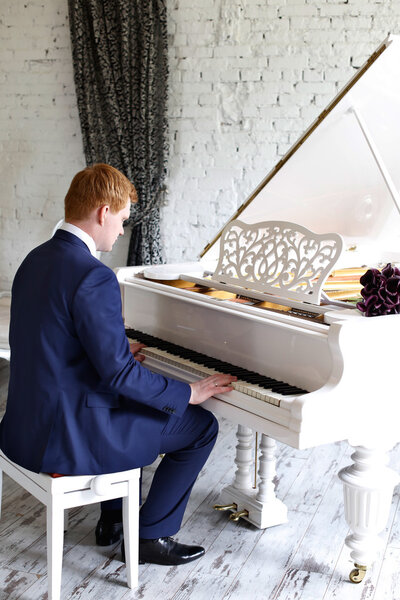 The groom in a lilac suit