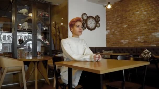 Portrait of mixed race woman posing in public cafe — Stock Video