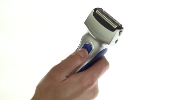 Electric shaver over white background — Stock Video