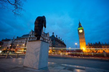 Big Ben and statue of Sir Winston Churchill, London, England clipart