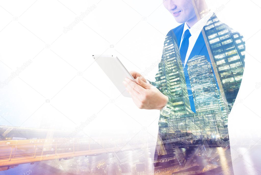 Double exposure of Asian businessman using the tablet 