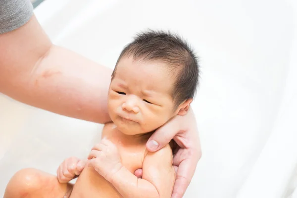 Asian newborn baby having a bath — Stock Photo, Image