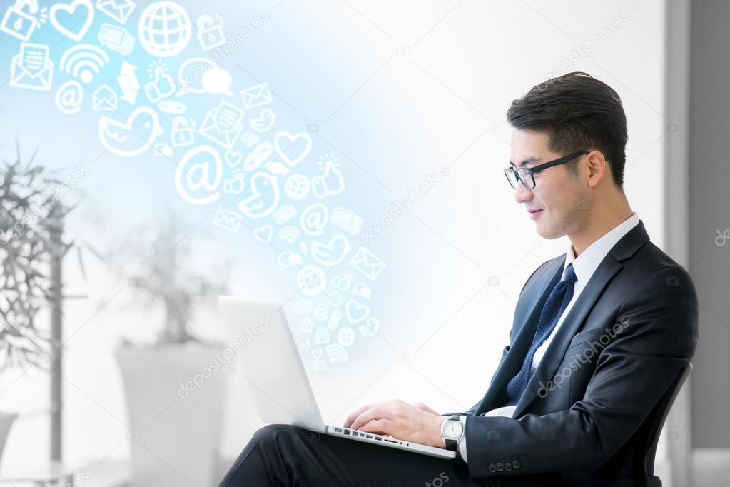 Young asian businessman using tablet, social meida