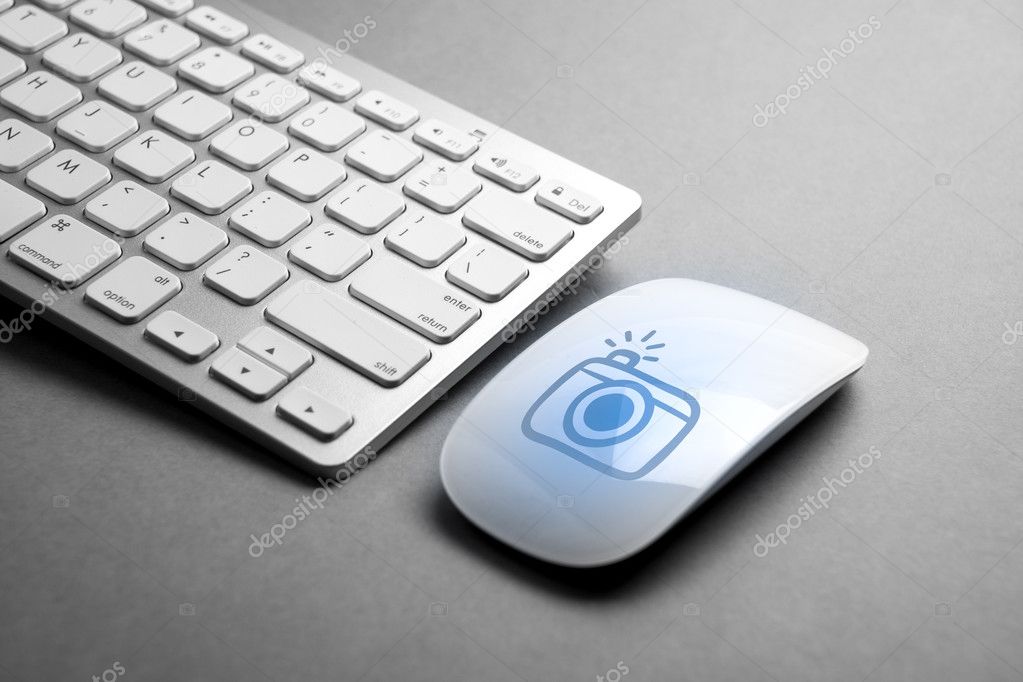Social media icon on mouse & computer keyboard