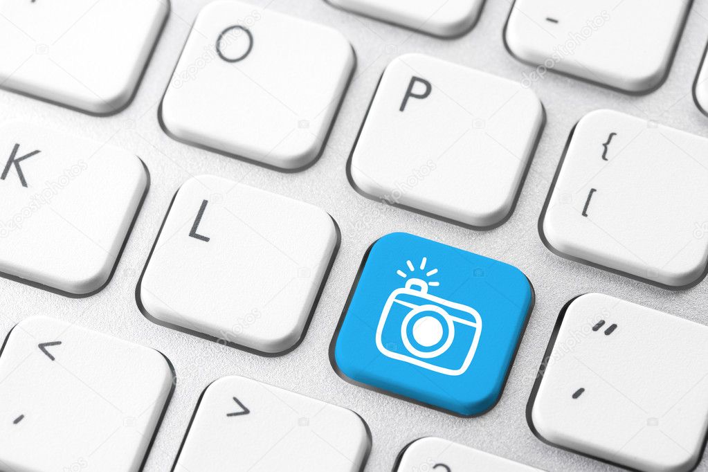 Camera & social media icon on computer keyboard