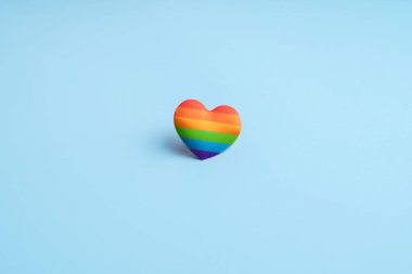 LGBTQ flag and symbol on table top view