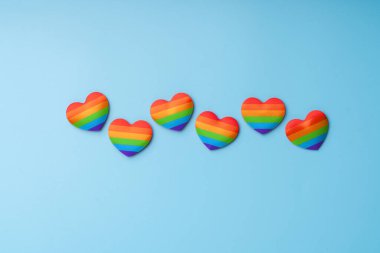 LGBTQ flag and symbol on table top view