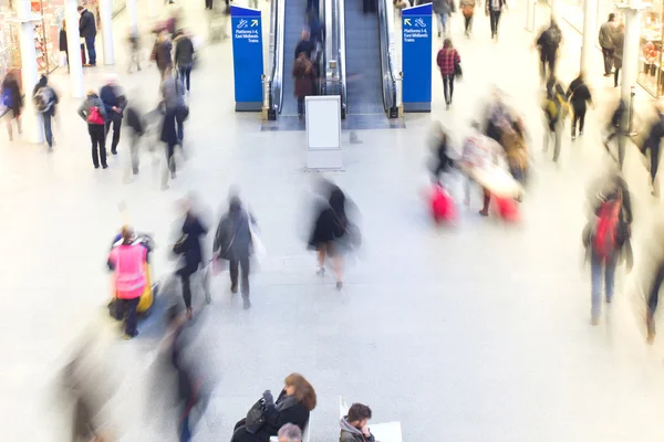 London Train Tube station Blur people movement in rush hour