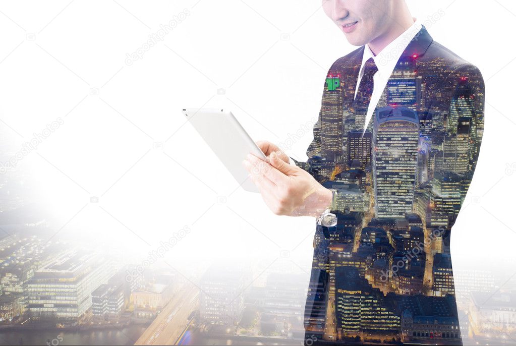 Double exposure of Asian businessman using the tablet 