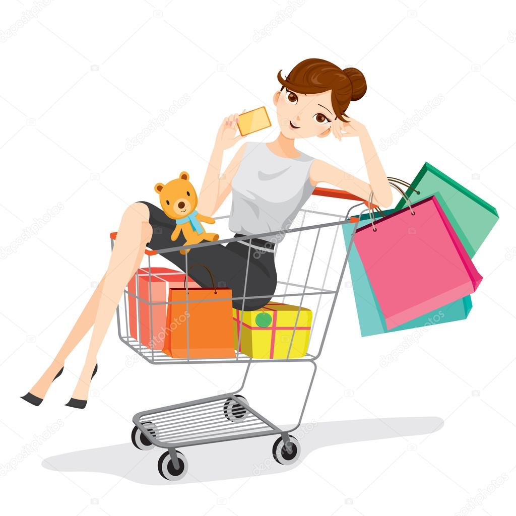 Woman holding card siting in shopping cart