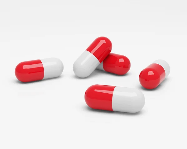 Red and white capsules — Stock Photo, Image