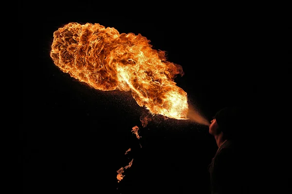 Fire artist performing fire breathing — Stock Photo, Image