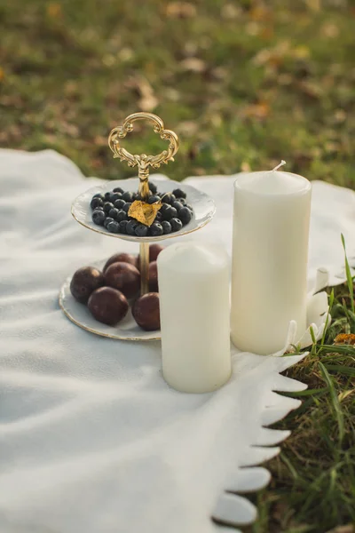 Autumn Still Life: plum, blueberry and candles — Stock Photo, Image