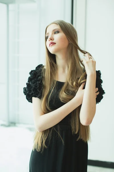 Portrait of beautiful young girl in dress — Stock Photo, Image