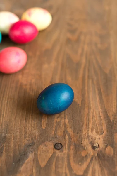 Easter colored eggs on the wooden background — Stock Photo, Image