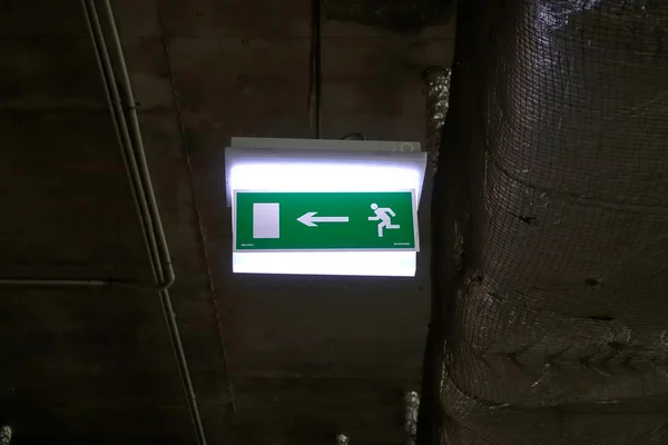 Exit sign in an underground car park — Stock Photo, Image