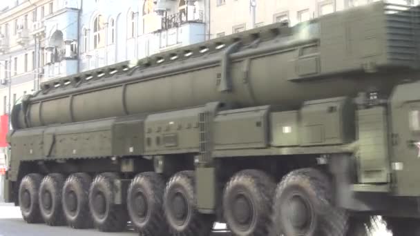 Topol-M (SS-27 Sickle B) intercontinental ballistic missiles and Tigr high-mobility armoured vehicle GAZ-2330 move in motorcade on Tverskaya Street on parade devoted to 68th anniversary of Victory Day on May 9, 2013 in Moscow. — Stock Video