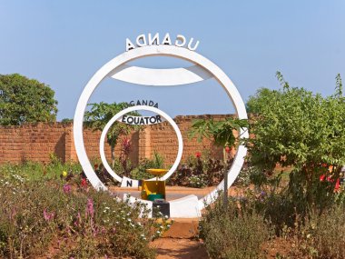 Equator crossing sign monument in Uganda clipart