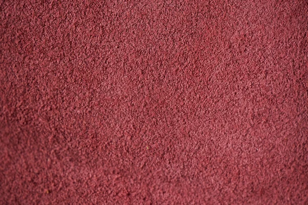 Natural rose color suede texture as background.