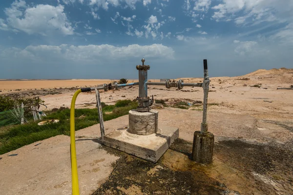 Water well in desert — Stock Photo, Image