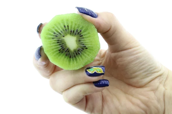Hand holding halve kiwi — Stockfoto