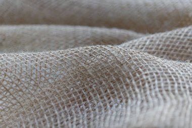 Çuval bezi kumaşı, kırsal dokuyu ve lifli ayrıntıları gösteriyor.