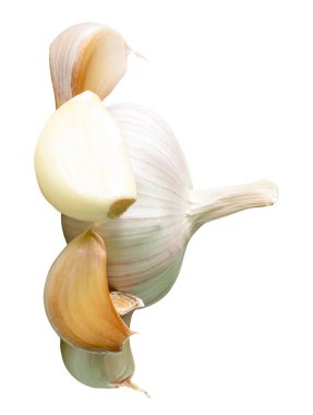 Garlic bulb with cloves in heap is isolated on white background with clipping path.