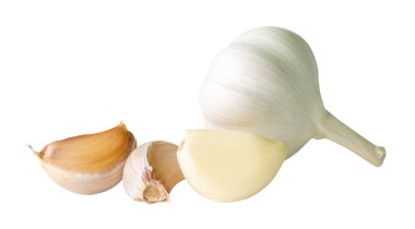 Garlic bulb with cloves in heap is isolated on white background with clipping path.