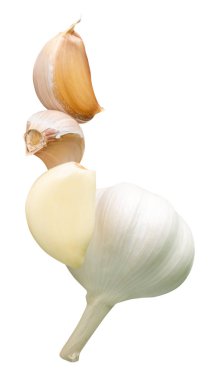 Garlic bulb with cloves in heap is isolated on white background with clipping path.