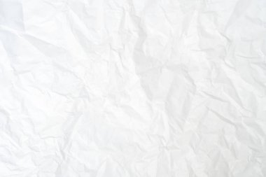 Üst görünüm ve buruşmuş beyaz kağıt dokusu dekoratif sanat eserlerinde buruşmuş beyaz kağıt arkaplan dokusu olarak kullanılır..