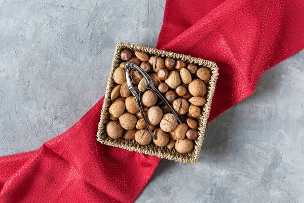 Variety Shelled Nuts Nutcracker Top View Grey Concrete Table Creative — Stock Photo, Image