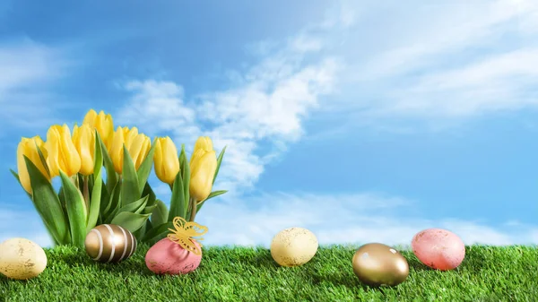 Yellow Spring Tulip Flowers Multicolored Easter Eggs Green Meadow Sky — Stock Photo, Image