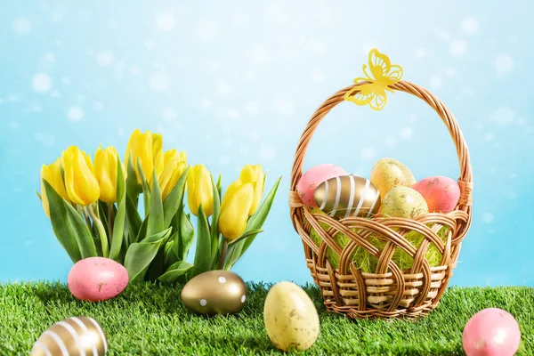 Basket Multicolored Easter Eggs Tulip Flowers Green Meadow Blue Background — Stock Photo, Image